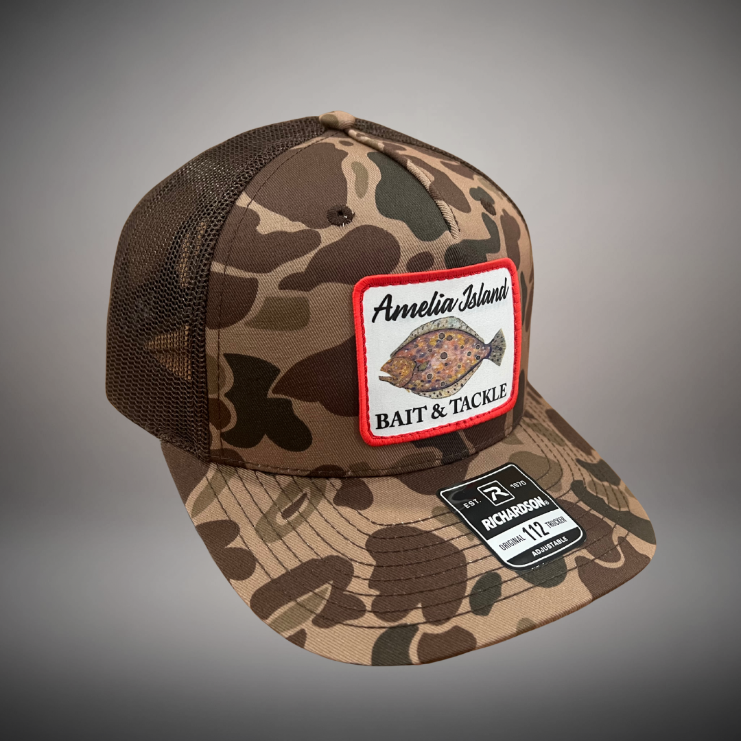 AIBT flounder patch trucker hat Richardson 112 in duck camo bark - studio view