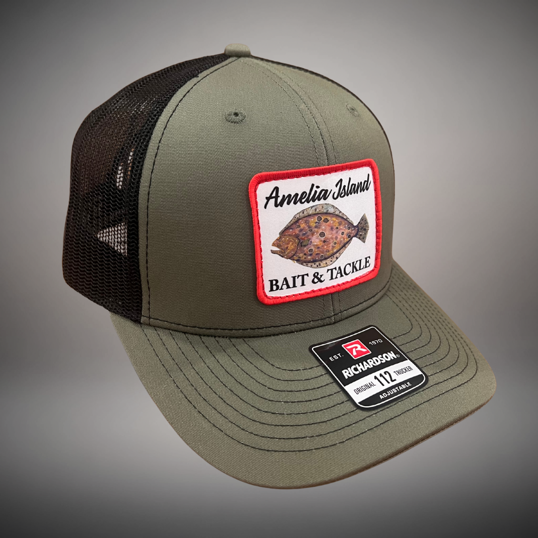 AIBT flounder patch trucker hat Richardson 112 in loden - studio view