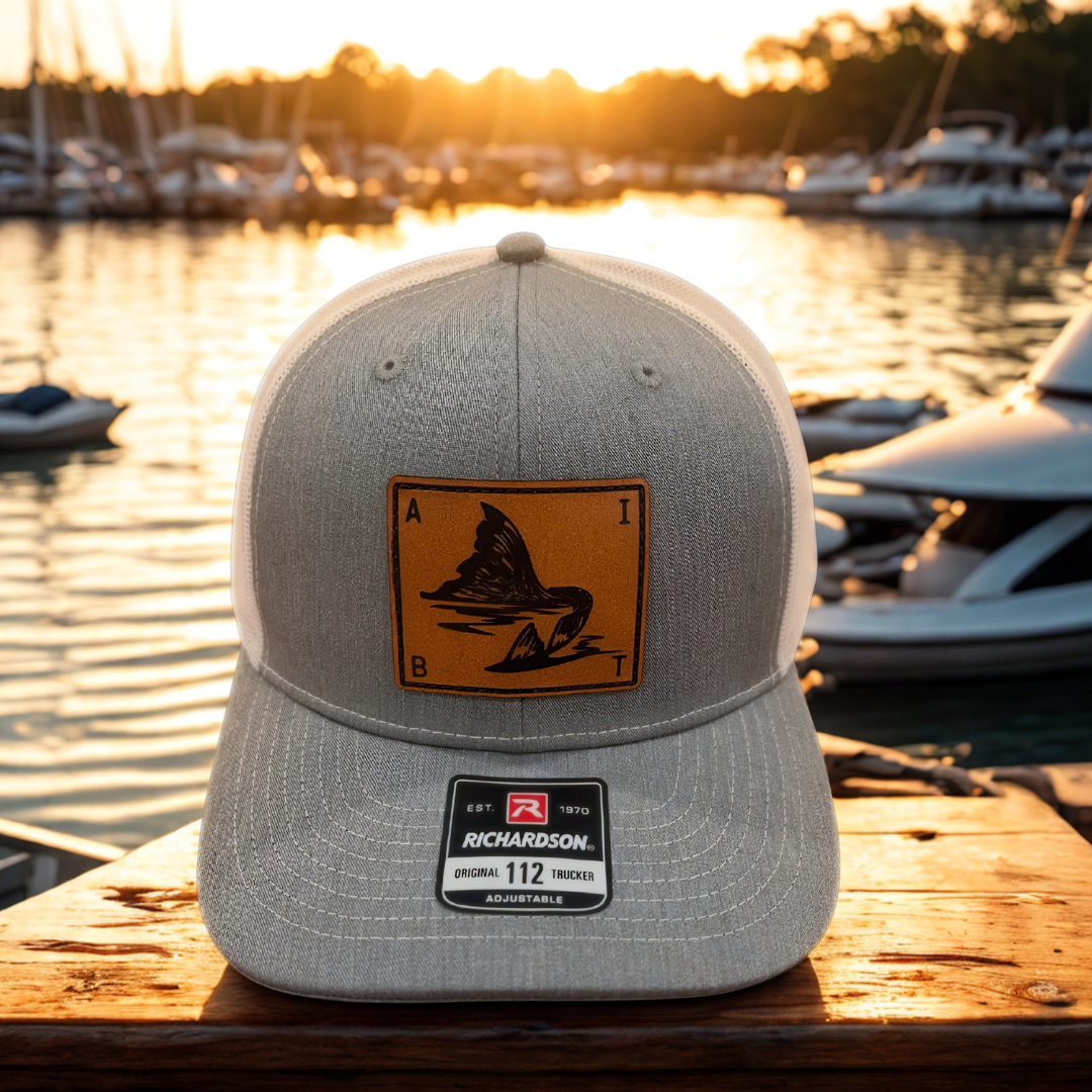 AIBT redfish tail leather patch trucker hat Richardson 112 in heather grey - hero view