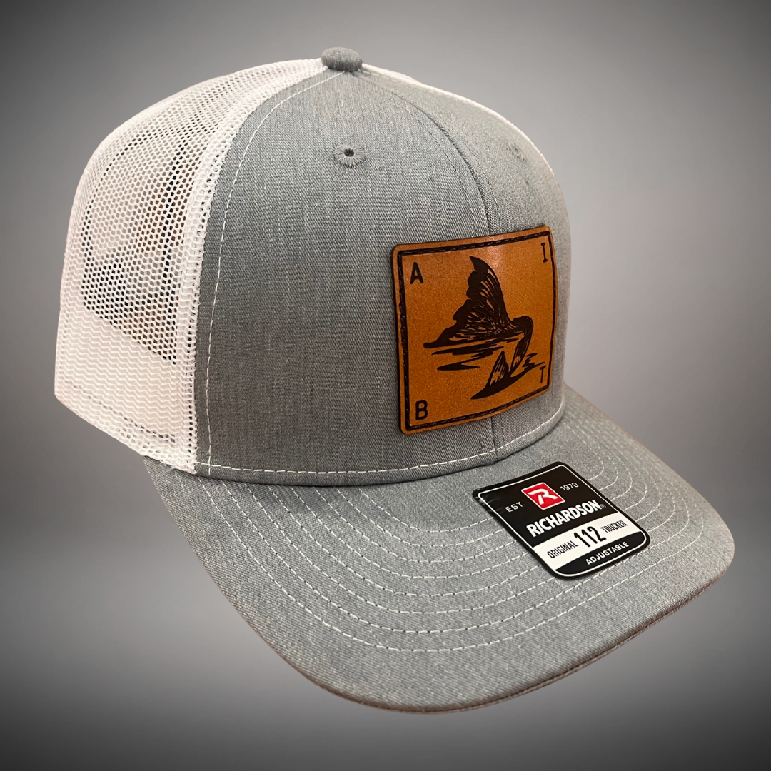 AIBT redfish tail leather patch trucker hat Richardson 112 in heather grey - studio view
