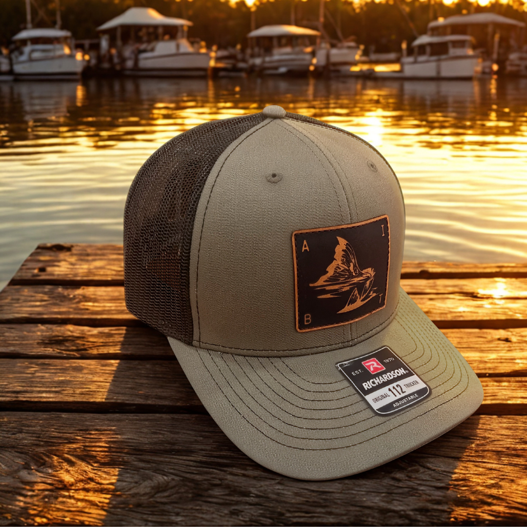 AIBT redfish tail leather patch trucker hat Richardson 112 in loden - hero view