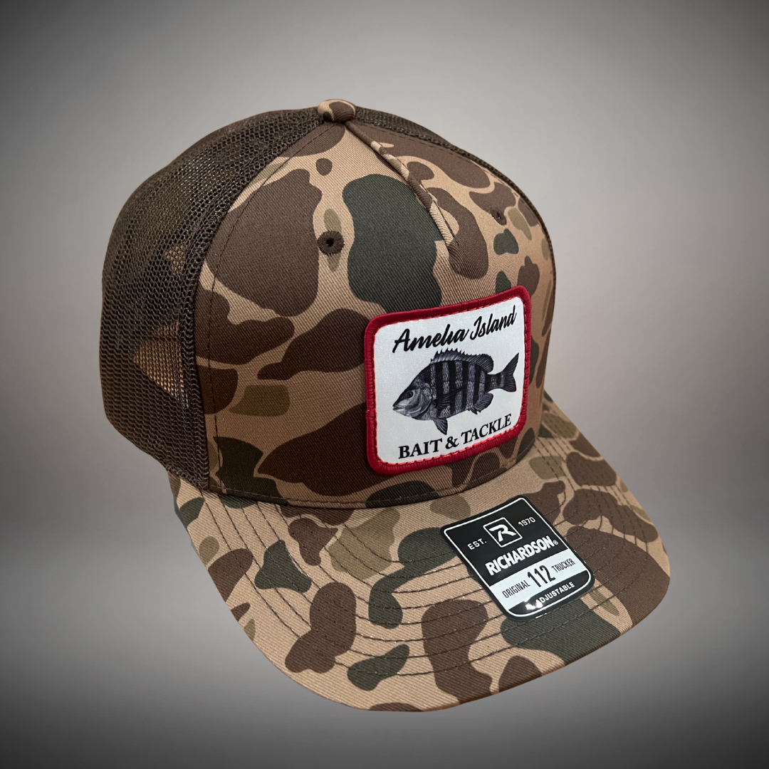 AIBT sheepshead patch trucker hat Richardson 112 in duck camo bark - studio view