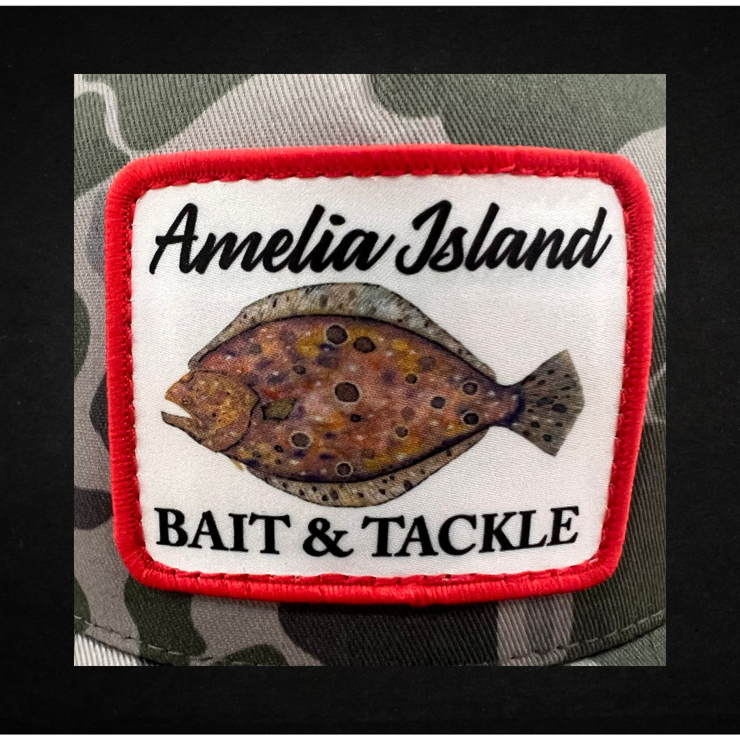 AIBT flounder patch trucker hat Richardson 112 in duck camo marsh - CU view