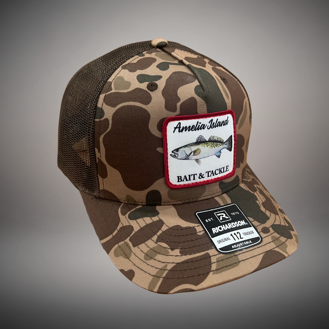 AIBT trout patch trucker hat Richardson 112 in duck camo bark –  studio view