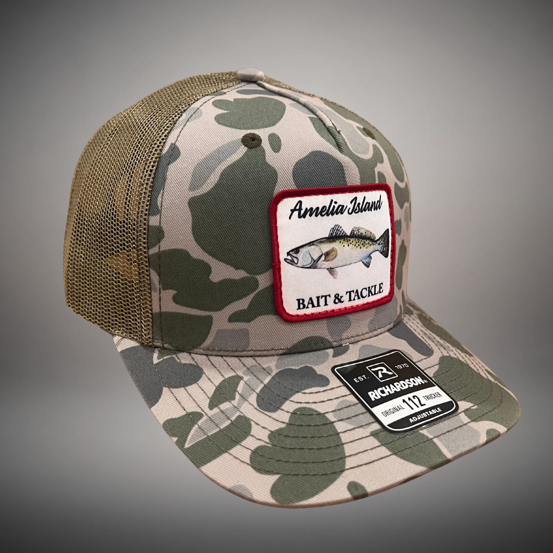 AIBT trout patch trucker hat Richardson 112 in duck camo marsh – studio view