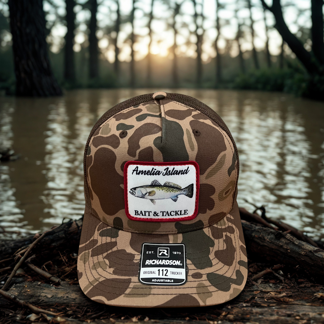 AIBT trout patch trucker hat Richardson 112 in duck camo bark – hero view